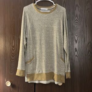 Gadewake light brown with gold trimmed sweater. Size Medium.